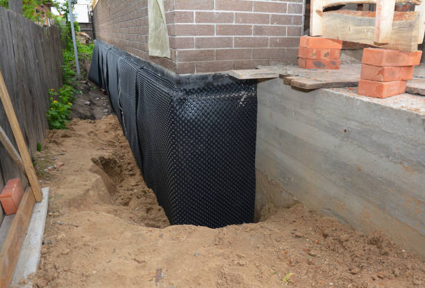 Happy homeowners after waterproofing job in Island Lake